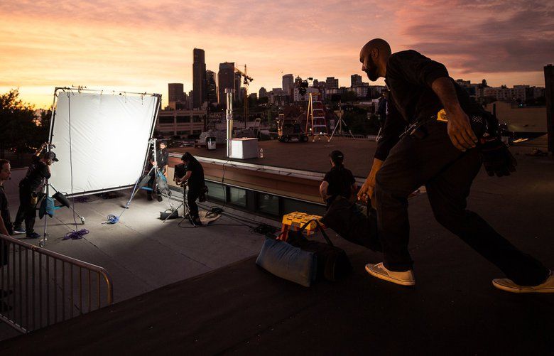 Crew members of The Paper Tigers, an indie Kung Fu Comedy, set up to film a fight scene on a rooftop in the International District on Thursday, September 5. Filmed entirely in the Seattle area, the premise of the film is three washed up fighters and estranged friends reconnecting to avenge the death of their old Kung Fu master. 211377