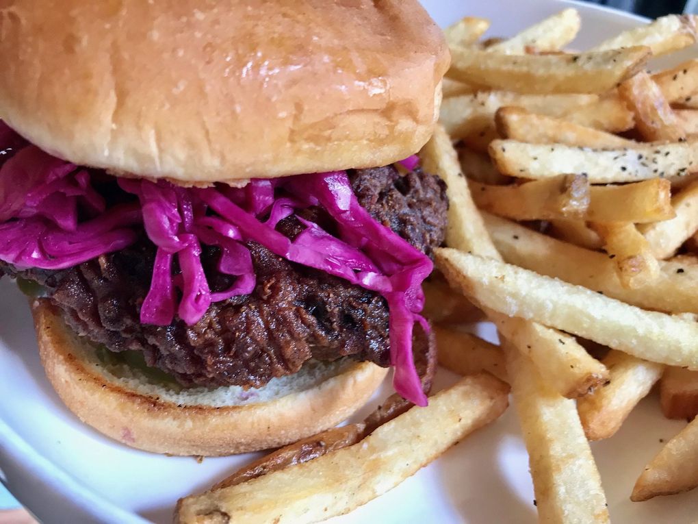 Monica Dimas does a pickle-brined thigh meat at Sunset Fried Chicken on Capitol Hill. (Tan Vinh / The Seattle Times)