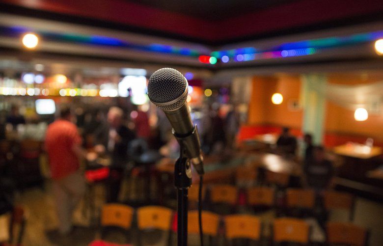 A microphone awaits performers in the Punchline Comedy Show, held in the back bar of the Jai Thai restaurant, on Friday, August 11, 2017 in Capitol Hill. 203101
