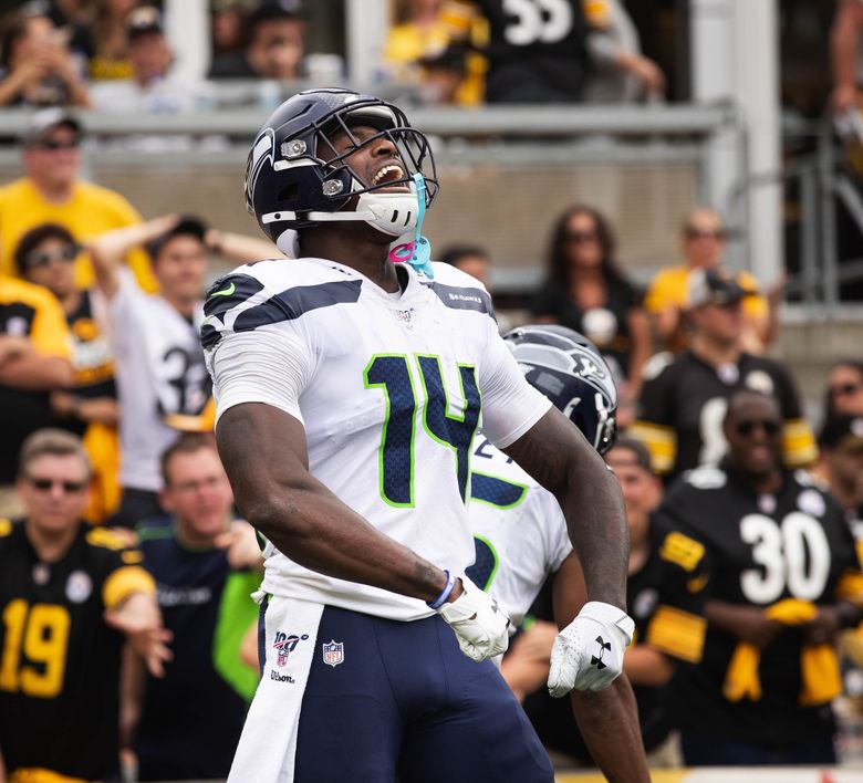 Seattle Seahawks' D.K. Metcalf catches a touchdown pass during the