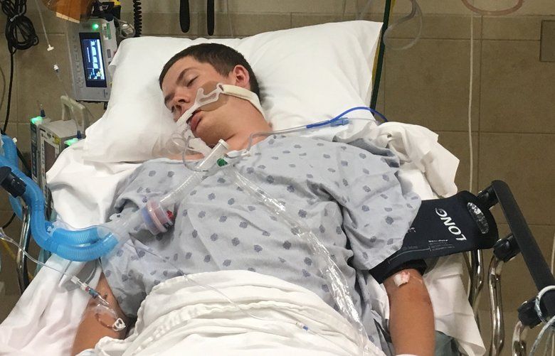 This May 2018, photo provided by Joseph Jenkins shows his son, Jay, in the emergency room of the Lexington Medical Center in Lexington, S.C. Jay Jenkins suffered acute respiratory failure and drifted into a coma, according to his medical records, after he says he vaped a product labeled as a smokable form of the cannabis extract CBD. Lab testing commissioned as part of an Associated Press investigation into CBD vapes showed the cartridge that Jenkins says he puffed contained a synthetic marijuana compound blamed for at least 11 deaths in Europe.  (Joseph Jenkins via AP) NY771 NY771