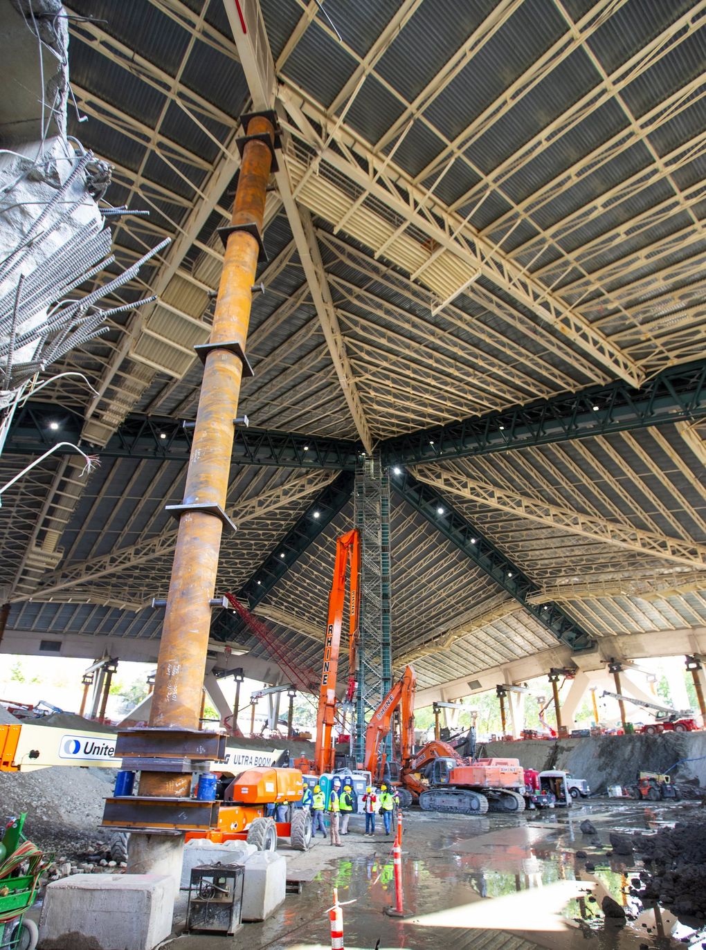 A high-level overview of the construction process at the Key Arena shows the progress of the new facility as crews work to support the roof as the floor of the arena will be lowered by an additional 15 feet. (Mike Siegel / The Seattle Times)
