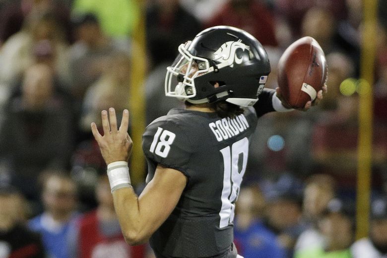 Anthony Gordon of the Washington State Cougars looks to throw the  Washington  state football, College football uniforms, Washington state cougars