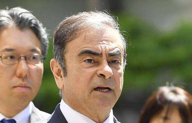 FILE – In this May 23, 2019, file photo former Nissan chairman Carlos Ghosn, center, arrives at Tokyo District Court for a pre-trial meeting in Tokyo.  Nissan has agreed to pay $15 million and its former chairman Carlos Ghosn is paying $1 million to settle federal regulators’ civil fraud charges of hiding from investors more than $140 million in compensation and retirement benefits for Ghosn. (Ren Onuma/Kyodo News via AP, File) NYBZ118 NYBZ118