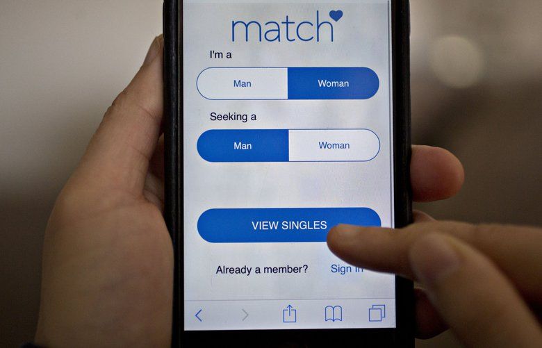 The Match.com website is demonstrated for a photograph on an Apple Inc. iPhone in Washington, D.C., U.S., on Sunday, Jan. 30, 2017. Match Group Inc. is expected to release fourth-quarter earnings figures on January 31. Photographer: Andrew Harrer/Bloomberg 695943897