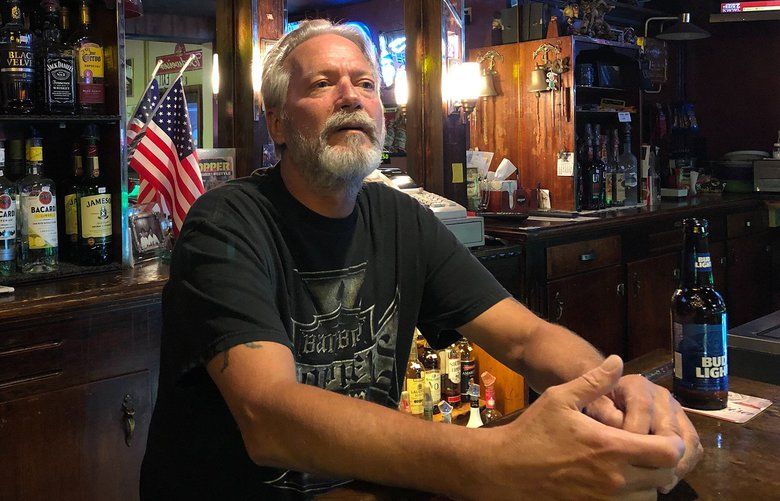 John LuGrain, a bar manager in Dubuque, Iowa, voted for President Trump in 2016 and plans to vote for him again in 2020. He’s convinced the impeachment inquiry is a “witch hunt,” comparing it to the Mueller investigation. (Tyrone Beason/Los Angeles Times/TNS) 1442729