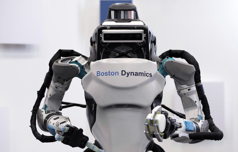 A Boston Dynamics Inc. Atlas humanoid robot is displayed at the SoftBank Robot World 2017 in Tokyo, Japan, on Tuesday, Nov. 21, 2017. SoftBank Chief Executive Officer Masayoshi Son has put money into robots, artificial intelligence, microchips and satellites, sketching a vision of the future where a trillion devices are connected to the internet and technology is integrated into humans. Photographer: Kiyoshi Ota/Bloomberg