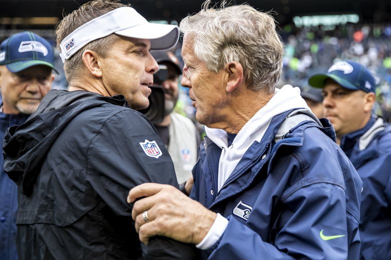 Seattle Seahawks head coach Pete Carroll gets ready to throw a