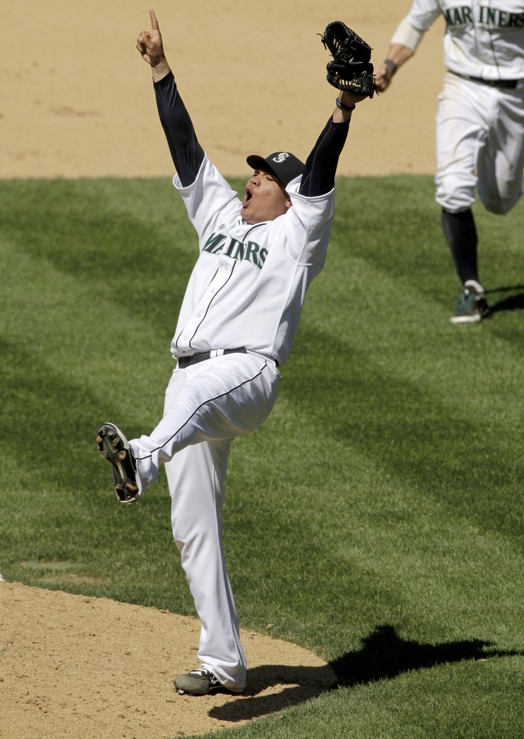 Felix Hernandez celebrates after pitching a perfect game in 2012. (Mark Harrison / The Seattle Times)