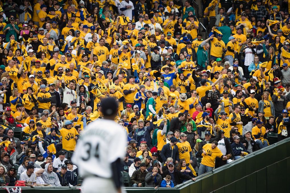 The King’s Court cheers as Mariners pitcher Felix Hernandez posts one of his 10 strikeout as the Seattle Mariners defeat the Los Angeles Angels 4-1 for Opening Day Monday April 6, 2015 at Safeco Field in Seattle. (Bettina Hansen / The Seattle Times)