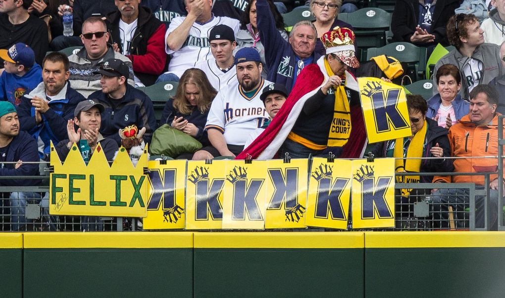 Fans in right field keep a running tally as Felix Hernandez records his seventh strikeout in a 2015 game against the Los Angeles Angels. (Dean Rutz / The Seattle Times)