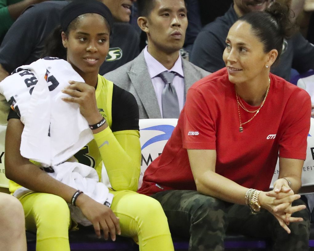 Seattle Storm guards Jordin Canada, left, and Sue Bird watch the game against Atlanta during the second half, Sunday, Sept. 1, 2019 in Seattle. 211361 (Ken Lambert / The Seattle Times)