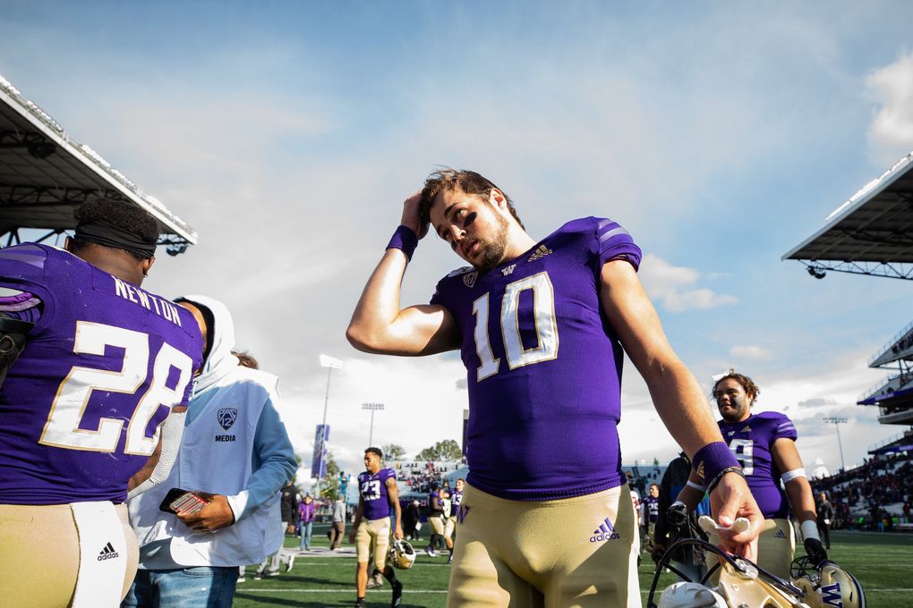 Washington Huskies quarterback Jacob Eason (10) walks off the field after the game Saturday. (Andy Bao / The Seattle Times)