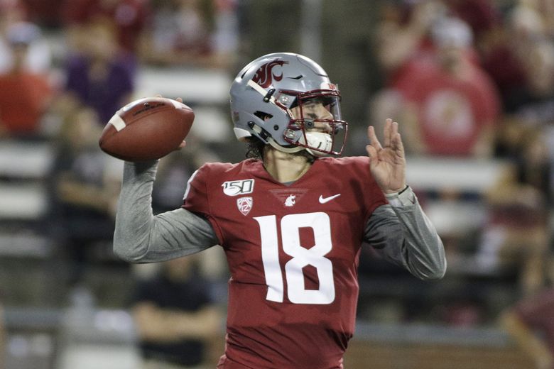 Anthony Gordon of the Washington State Cougars looks to throw the  Washington  state football, College football uniforms, Washington state cougars