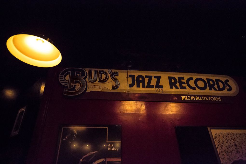 Mementos from Seattle’s jazz scene, including the huge wooden sign that once advertised Bud’s Jazz Records in Pioneer Square, decorate the walls of Tula’s Restaurant and Jazz Club. (Rebekah Welch / The Seattle Times)