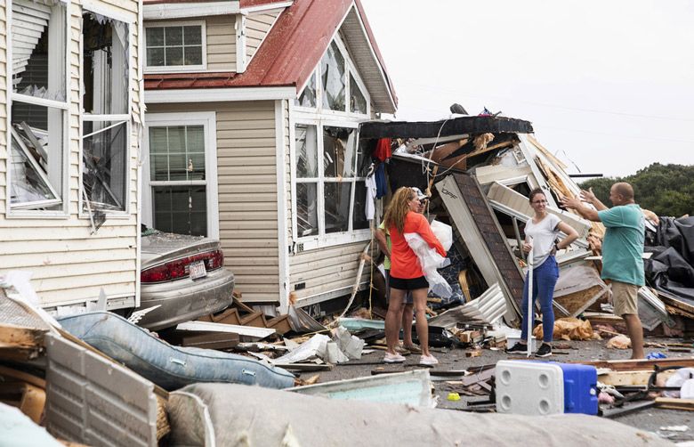 Dorian’s floodwaters trap people in attics in North Carolina | The ...