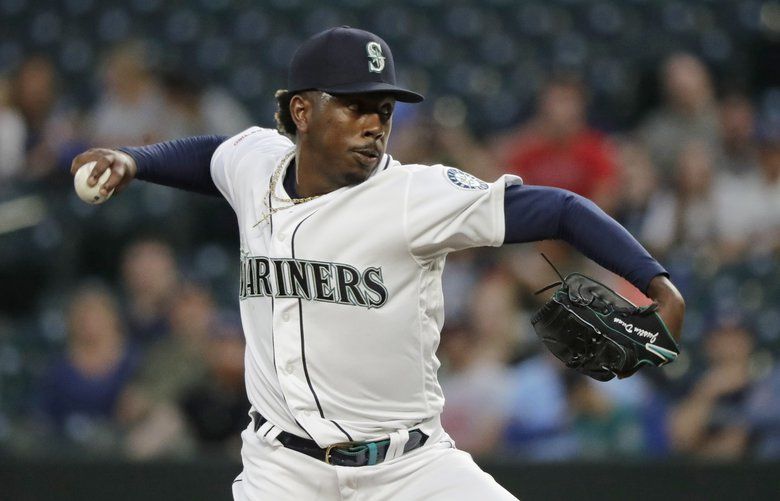 Seattle Mariners starting pitcher Justin Dunn throws to a Cincinnati Reds batter during the first inning of a baseball game Thursday, Sept. 12, 2019, in Seattle. (AP Photo/Ted S. Warren) WATW103 WATW103