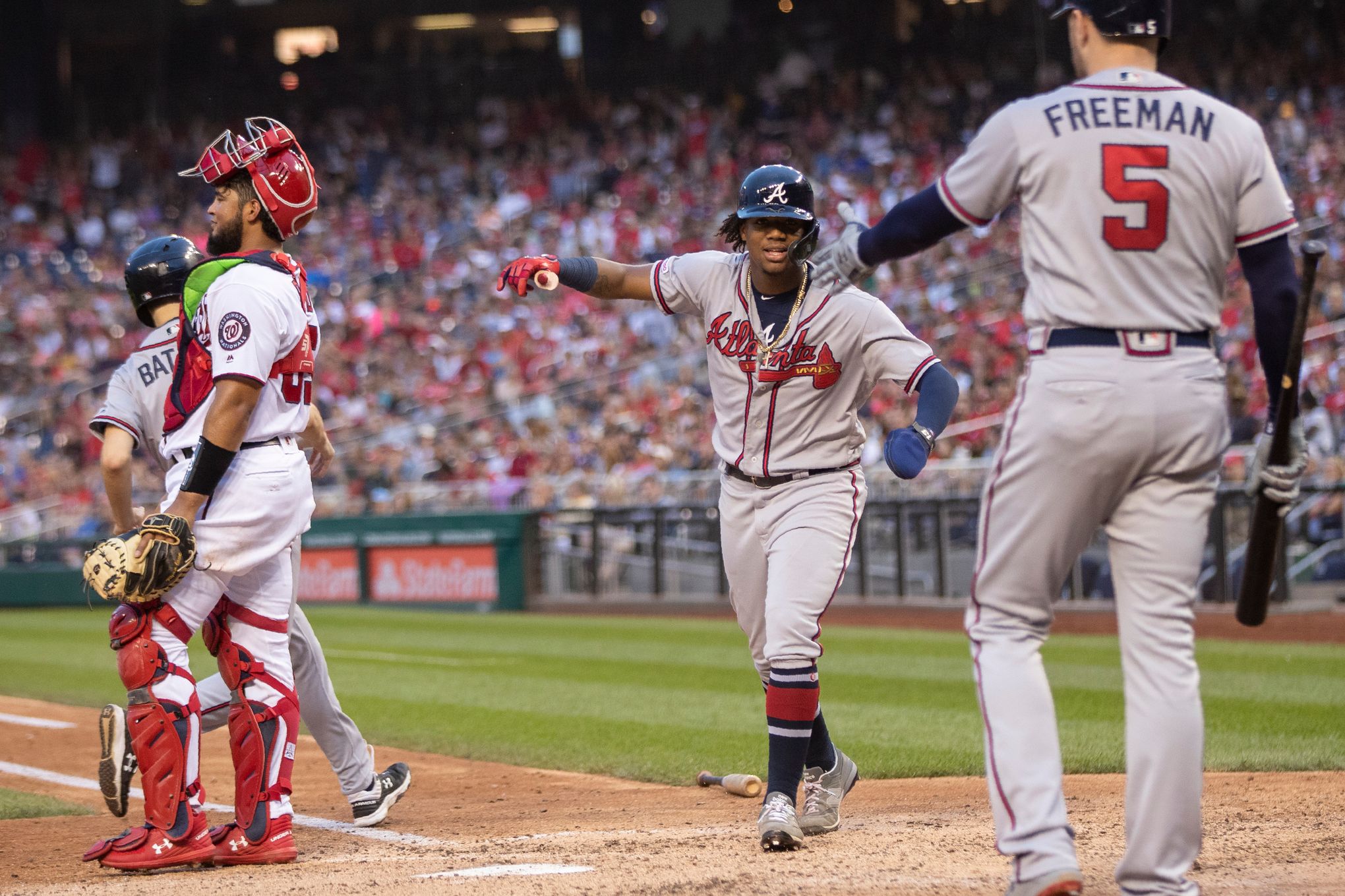 Braves clinch playoff spot behind Acuña Jr.