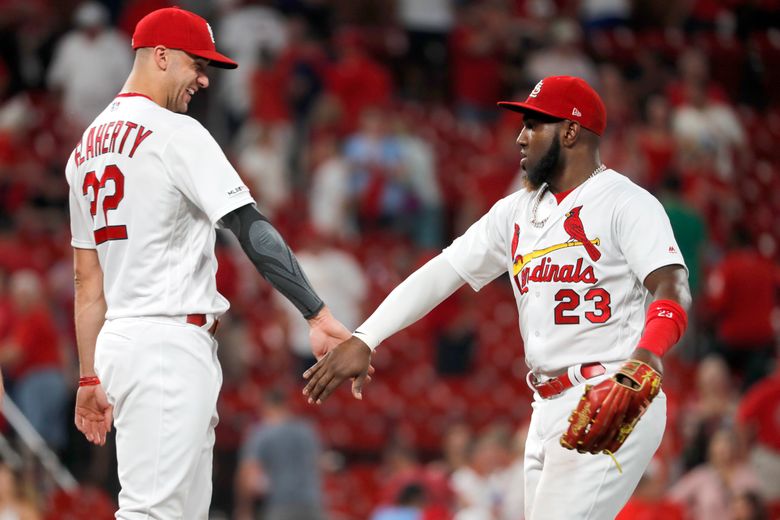 Ozuna's 4 RBIs, throw to plate lift Cards over Nats 4-2