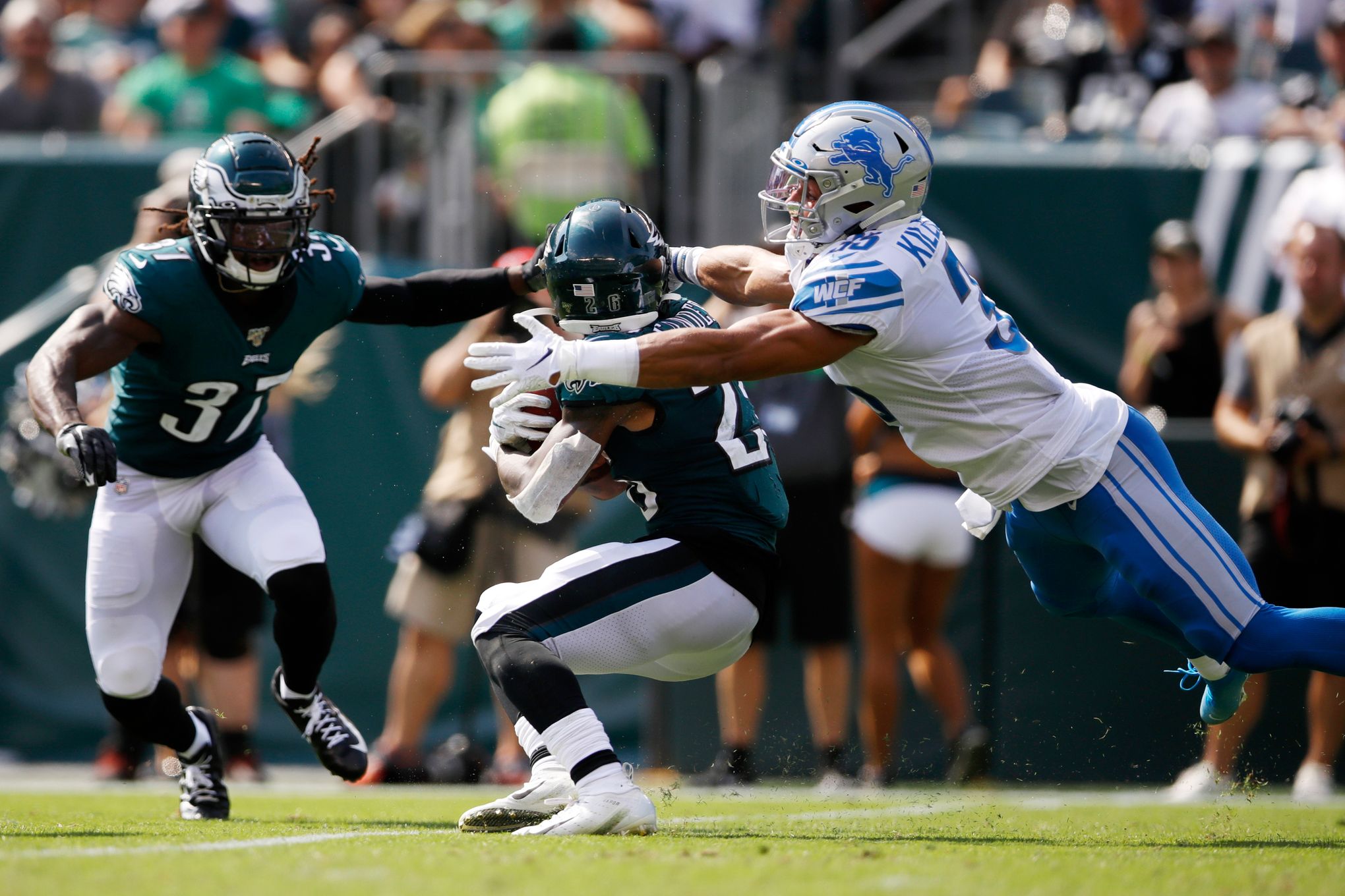 Philadelphia Eagles' Miles Sanders has helmet ripped off on kick return