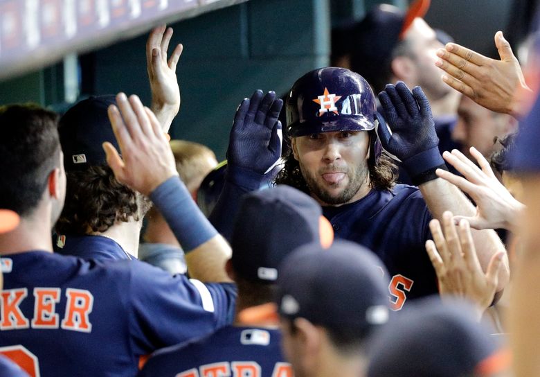 Cole's birthday gem leads Astros over M's 21-1 for sweep