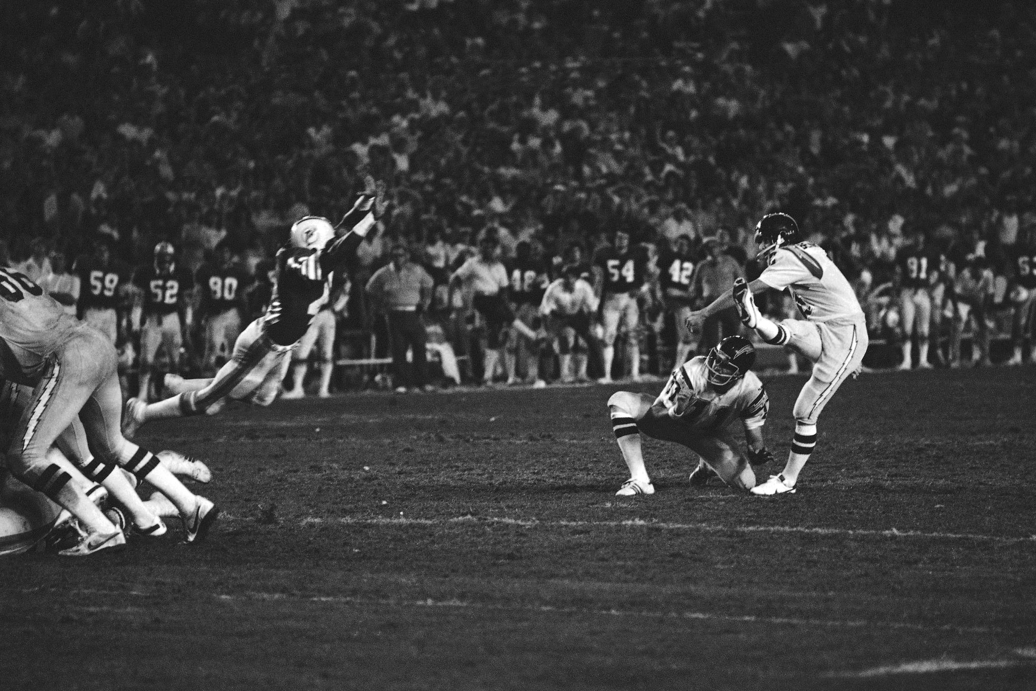 Dan Fouts of the San Diego Chargers drops back to pass against the