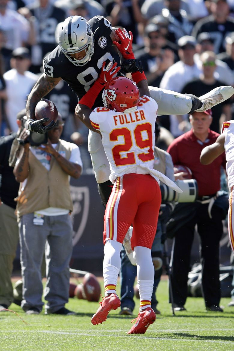 Oakland Raiders tight end Darren Waller runs the ball during an NFL  football game against the D …