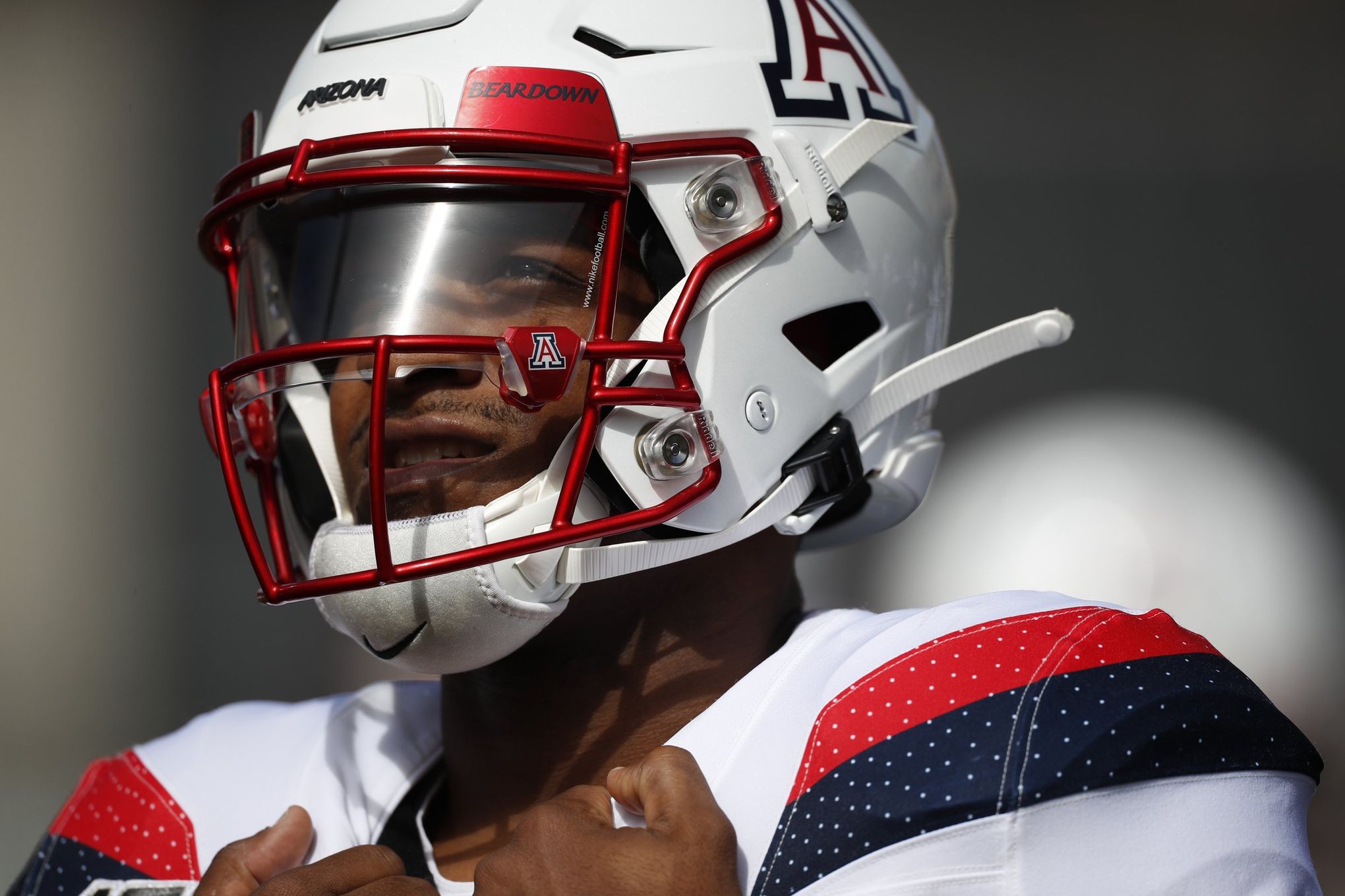 Running back Gary Brightwell of the Arizona Wildcats runs the ball to