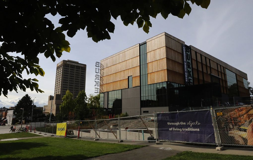 The new Burke Museum was designed by architect Tom Kundig with a rustic-modern exterior where vertical planks of natural wood meet dark glass. (Alan Berner / The Seattle Times)