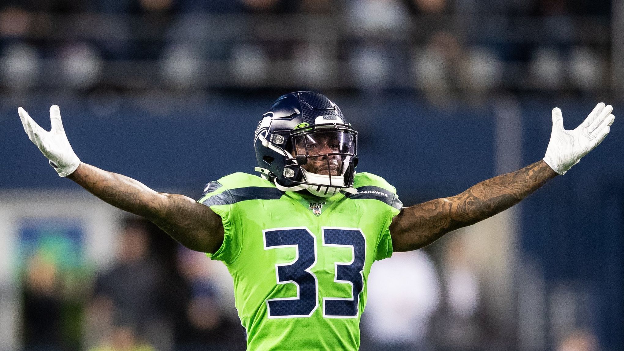 Seattle Seahawks free safety Tedric Thompson (33) reaches out to intercept  a pass intended for Los Angeles Rams tight end Gerald Everett, center,  during the second half of an NFL football game