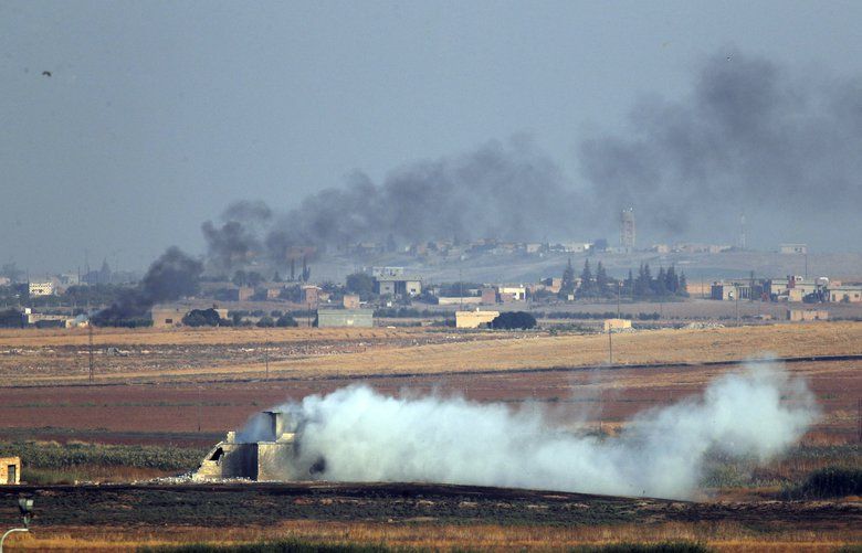 In this photo taken from the Turkish side of the border between Turkey and Syria, in Akcakale, Sanliurfa province, southeastern Turkey, smoke billows from targets inside Syria during bombardment by Turkish forces Wednesday, Oct. 9, 2019. Turkey launched a military operation Wednesday against Kurdish fighters in northeastern Syria after U.S. forces pulled back from the area, with a series of airstrikes hitting a town on Syria’s northern border.(AP Photo/Lefteris Pitarakis) AXLP114 AXLP114