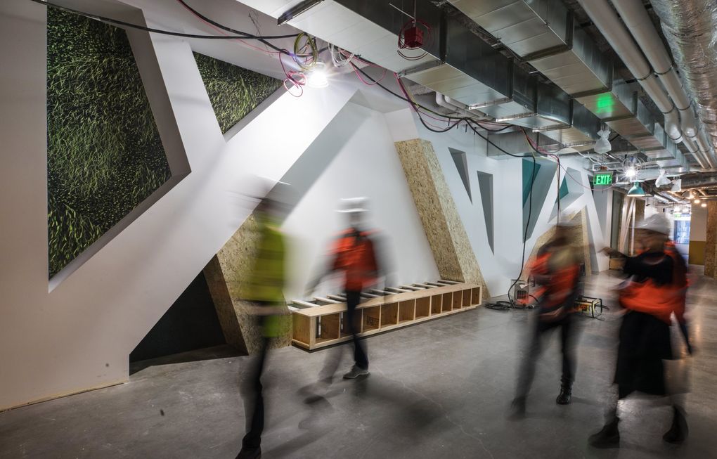 Nooks and seating areas are built into a wall that separates Mary’s Place from the Amazon corporate offices on the other side. (Steve Ringman / The Seattle Times)