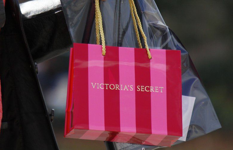 FILE – In this Nov. 17, 2009 file photo, a customer carries her purchase from a Victoria’s Secret store in Flowood, Miss. (AP Photo/Rogelio V. Solis, file) NYBZ193