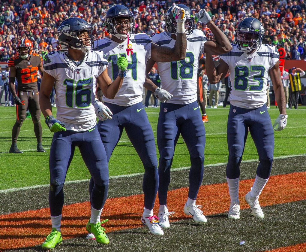 Seahawks wide receivers (left to right) Tyler Lockett, DK Metcalf, Jaron Brown and David Moore celebrate Brown’s first-half touchdown Sunday in Cleveland. (Mike Siegel / The Seattle Times)