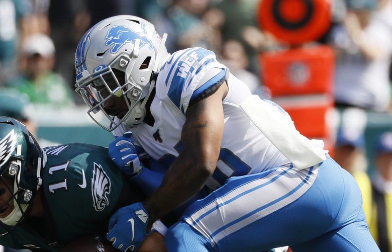 Philadelphia Eagles’ Carson Wentz, left, is tackled by Detroit Lions’ Quandre Diggs during the first half of an NFL football game, Sunday, Sept. 22, 2019, in Philadelphia. (AP Photo/Michael Perez) PXE105