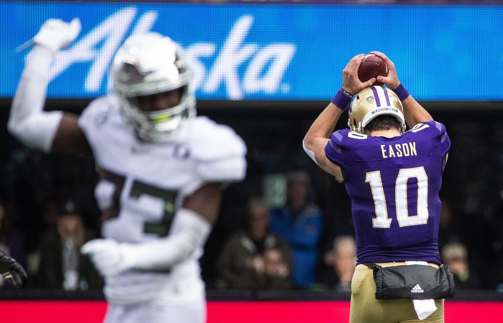 Jacob Eason appears to want to drill the ball into the turf after the Huskies were called for being offsides, leaving the Dawgs 3rd and 23 in their final series of the game. The 12th-ranked Oregon Ducks played the 25th-ranked Washington Huskies Friday, October 18, 2019 at Husky Stadium in Seattle, WA. (Dean Rutz / The Seattle Times)