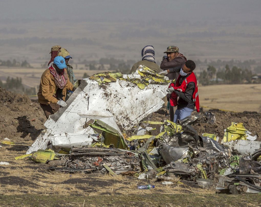 Rescuers work at the scene of an Ethiopian Airlines jet crash south of Addis Ababa, Ethiopia, March 11, 2019. Boeing’s 737 MAX 8 aircraft has been grounded worldwide as a result of this crash and another last October. (Mulugeta Ayene / The Associated Press)