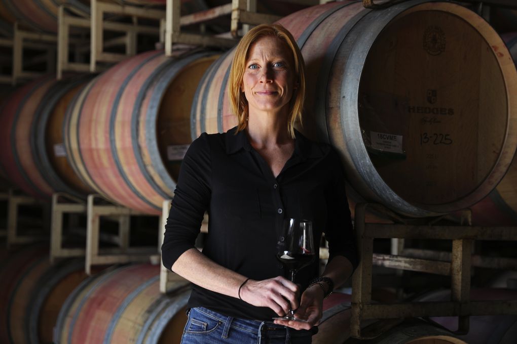 Winemaker Sarah Hedges Goedhart holds a glass of Hedges Family Estate’s 2016 red blend. (Ken Lambert / The Seattle Times)