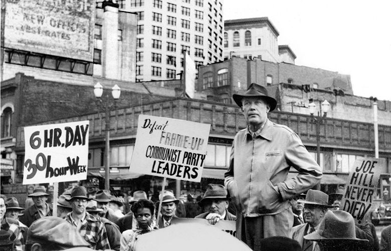THEN: Here the square jaw of labor activist Terry Pettus holds steady like a confident variation of the Smith Tower rising behind him.
