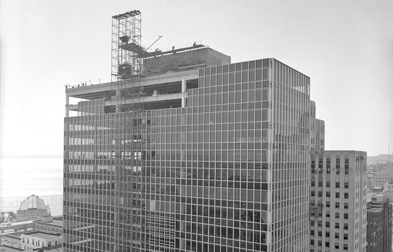 THEN: Roger Dudley Jr. photographed the Norton Building in 1959 looking northwest from the Dexter Horton Building roof. Built in 1924 at Second Avenue and Cherry Street, the Dexter Horton’s 15 stories were not so alluring to panoramists as the Smith Tower, dedicated in 1914, a block-and-a-half south on Second Avenue at Jefferson Street and about 40 spectacular stories high.