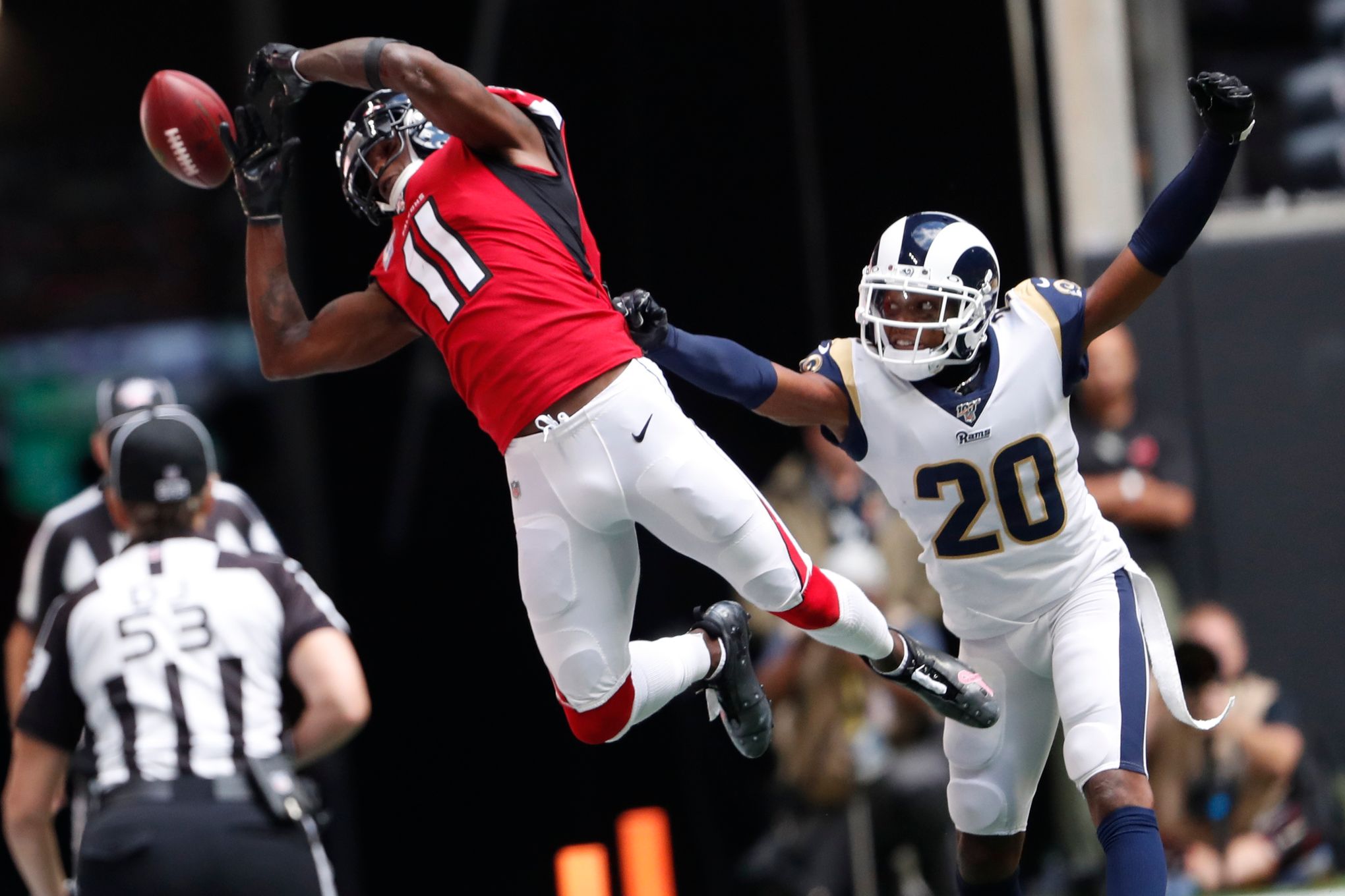 Aqib Talib of the Los Angeles Rams picks up a fumble against the