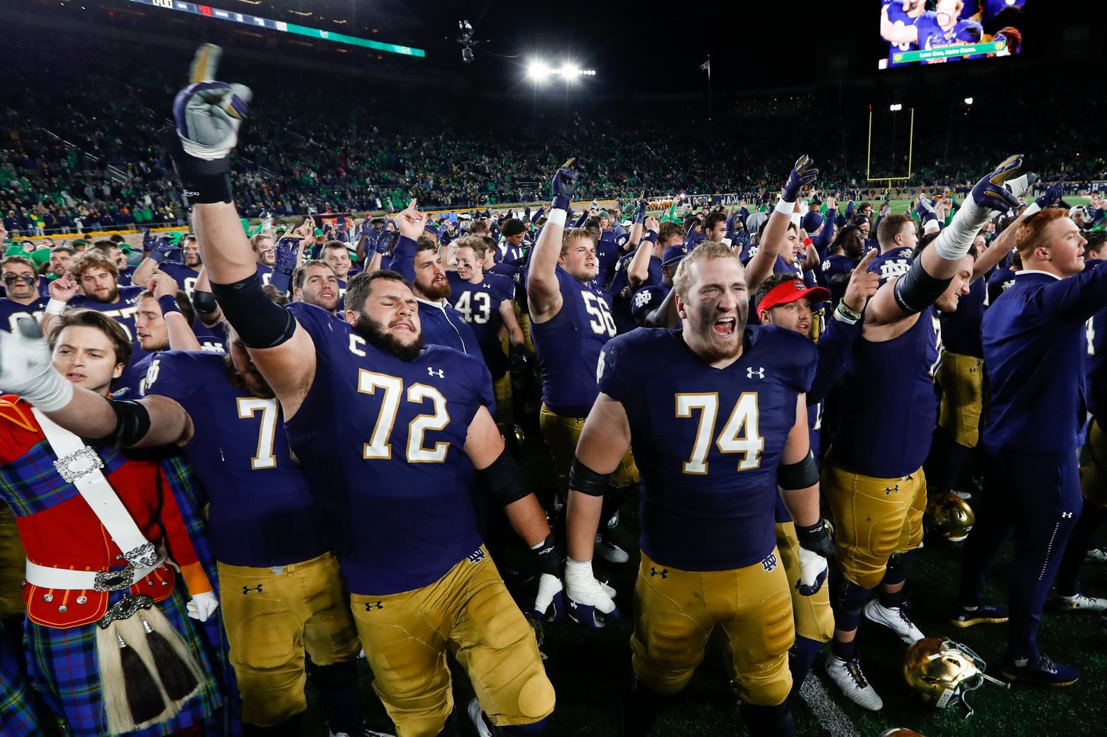 Notre Dame quarterback Ian Book and Liam Eichenberg celebrate a