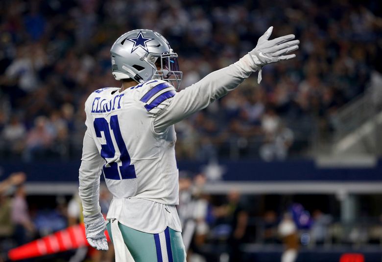 Dallas Cowboys running back Ezekiel Elliott (21) carries the ball