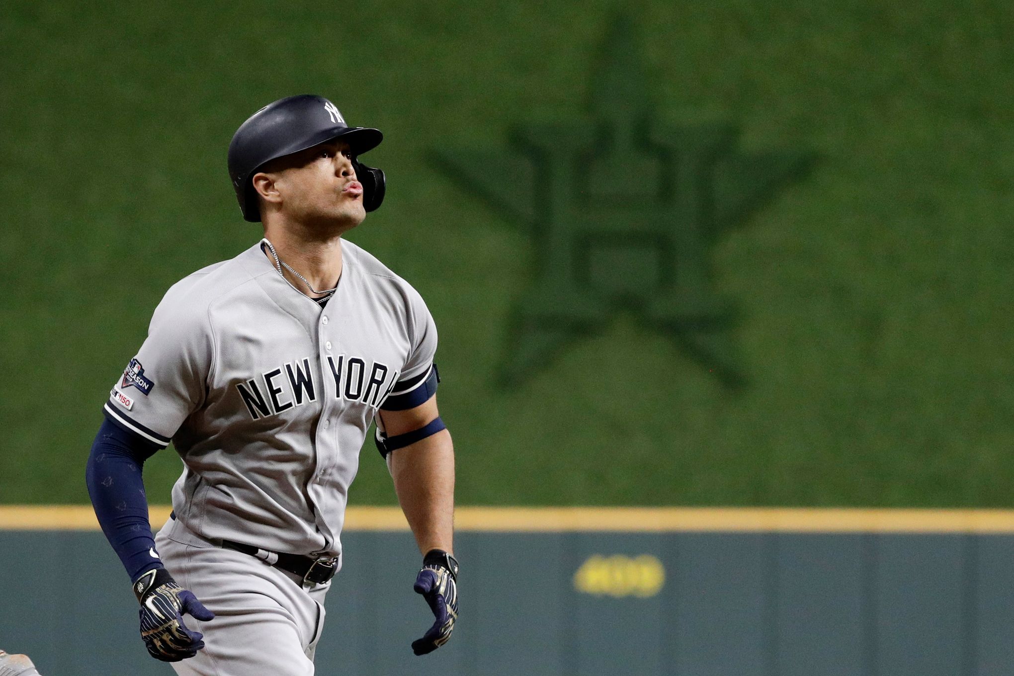 New York Yankees' Giancarlo Stanton rounds the bases after hitting