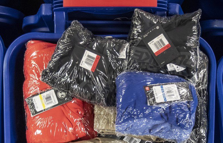 Clothing that is bought by Brian Freifelder’s company from retail stores on sale then repackaged to be shipped to an Amazon warehouse.. (Michael Bryant/THe PHiladelphia Inquirer/TNS)  1480781 1480781