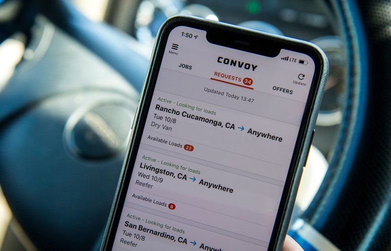 Amit Sekhri holds a smartphone displaying the Convoy application in Patterson, California, U.S., on Monday, Oct. 7, 2019. Photographer: David Paul Morris/Bloomberg 775428869
