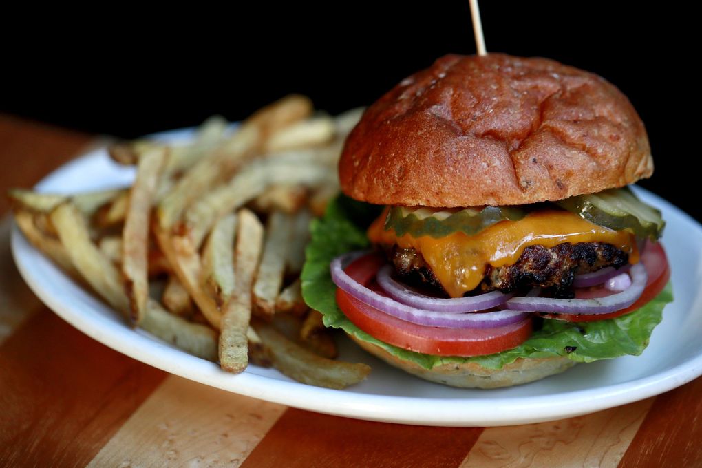 The cheeseburger and fries at Skylark Cafe & Club in West Seattle. (Erika Schultz / The Seattle Times)