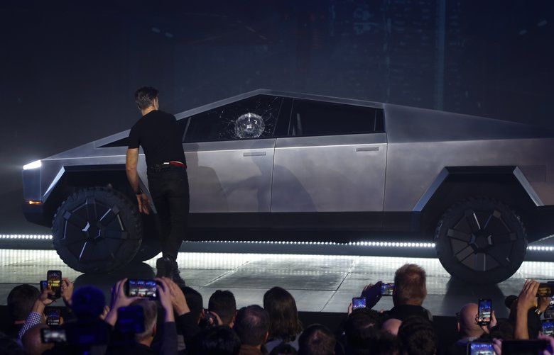 Tesla CEO Elon Musk introduces the Cybertruck at Tesla’s design studio Thursday, Nov. 21, 2019, in Hawthorne, Calif. Musk is taking on the workhorse heavy pickup truck market with his latest electric vehicle. (AP Photo/Ringo H.W. Chiu) NYOTK NYOTK