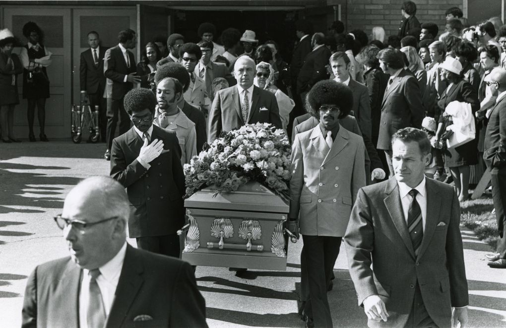 Jimi Hendrix’s casket is carried from the Dunlap Baptist Church after his funeral in 1970. The pallbearers included Herb Price, left, Hendrix’s valet; Donny Howell, a childhood friend, behind Price; and Eddie Rye, another friend, right. Behind the casket is Bernard Freeley, a funeral-home manager. (Pete Liddell / The Seattle Times)