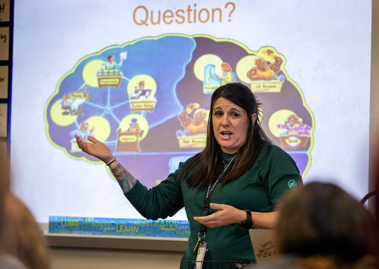 Amber Langon, a prevention/intervention counselor for the Shoreline School District, gives a presentation to students in Joann Fukuma’s health class on how vaping and drugs affect brain development. (Mike Siegel / The Seattle Times)